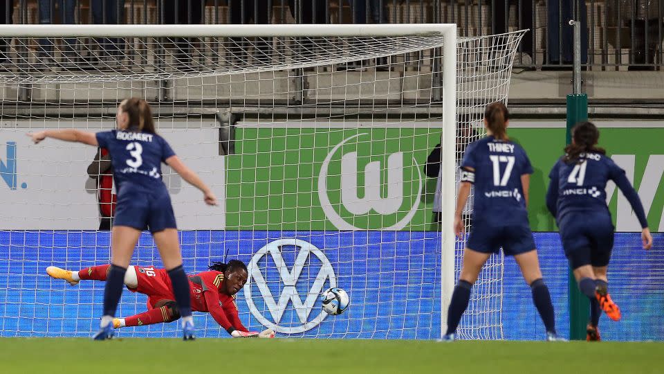 Chiamaka Nnadozie of Paris FC saves a penalty during the UEFA Women's Champions League qualifying round second leg match against VfL Wolfsburg on October 18, 2023 in Wolfsburg, Germany. - Cathrin Mueller/Getty Images Europe/Getty Images