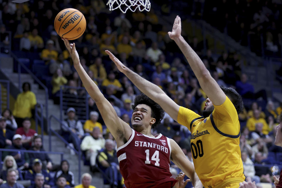 Stanford forward Spencer Jones (14) shoots against California forward Fardaws Aimaq (00) during the second half of an NCAA college basketball game in Berkeley, Calif., Friday, Jan. 26, 2024. (AP Photo/Jed Jacobsohn)