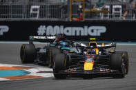 Red Bull driver Sergio Perez of Mexico steers his car in front of Mercedes driver George Russell of Britain during the practice session for the Formula One Miami Grand Prix auto race, Friday, May 3, 2024, in Miami. (AP Photo/Rebecca Blackwell)
