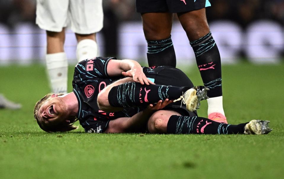 Pain: Kevin De Bruyne was injured in the second half against Tottenham (REUTERS)