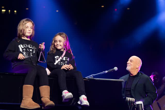 <p>Myrna M. Suarez/Getty Images</p> Billy Joel and his two daughters, Della and Remy