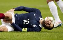 France's captain Karim Benzema reacts during their international friendly soccer match against Brazil at the Stade de France, in Saint-Denis, near Paris, March 26, 2015. REUTERS/Charles Platiau