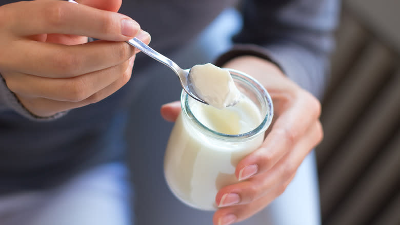 yogurt spooned out of jar