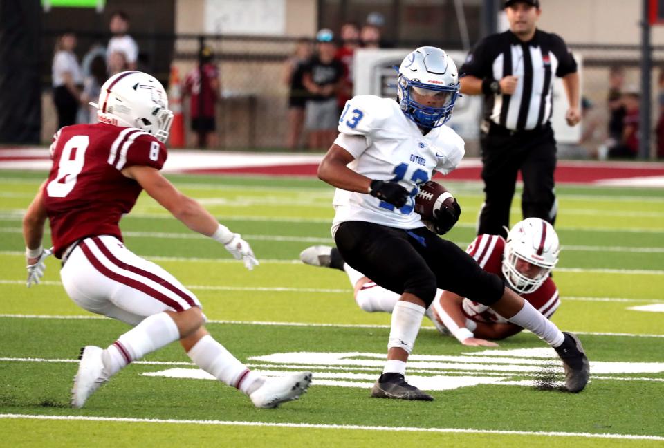 Guthrie's Jaylen Harper tries to elude tacklers last season at Tuttle. Harper had 584 rushing yards and 208 receiving yards for eight touchdowns as a junior.