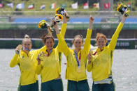 Lucy Stephan, Rosemary Popa, Jessica Morrison and Annabelle McIntyre, of Australia, celebrate with the gold medal following the women's rowing four final at the 2020 Summer Olympics, Wednesday, July 28, 2021, in Tokyo, Japan. (AP Photo/Darron Cummings)