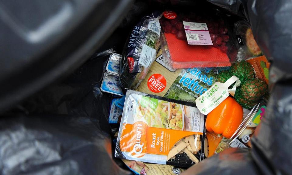 ‘Out-of-date’, unopened food in a household rubbish bin.