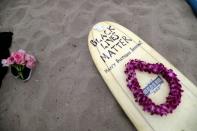 at a surf paddle out in memory of George Floyd, who died in Minneapolis police custody, in Santa Monica