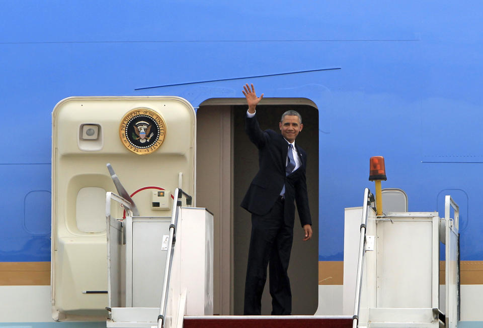 President Barack Obama waves as he boards Air Force One at the Royal Malaysian Air Force base in Subang, Malaysia, Monday, April 28, 2014, before heading to Ninoy Aquino International Airport in Pasay, Philippines. (AP Photo/Lai Seng Sin)