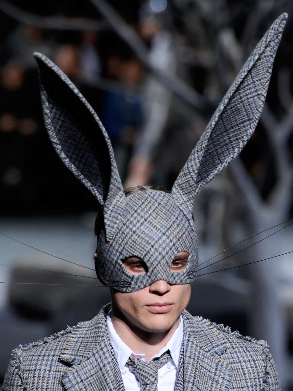 A model presents a creation as part of American fashion designer Thom Browne's men's Fall-Winter 2014-2015 fashion collection, presented Sunday, Jan. 19, 2014 in Paris. (AP Photo/Zacharie Scheurer)