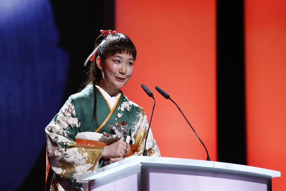 Actress Haru Kuroki receives the Silver Bear as Best Actress for the movie The Little House during the award ceremony at the International Film Festival Berlinale in Berlin, Saturday, Feb. 15, 2014. (AP Photo/Axel Schmidt)