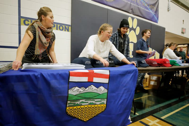 FILE PHOTO: Volunteers set up an Alberta flag during a rally for Wexit Alberta, a separatist group seeking federal political party status, in Calgary