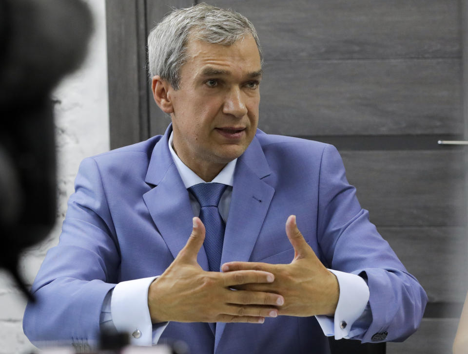 In this photo taken on Tuesday, Aug. 18, 2020, Pavel Latushko, former culture minister and Belarusian Ambassador to France, speaks during a news conference in Minsk, Belarus. A former culture minister and ambassador to France, is the only former senior official in an opposition council created to facilitate the transition of power amid massive protests challenging the extension of the 26-year rule of Belarus' authoritarian leader. (AP Photo/Sergei Grits)