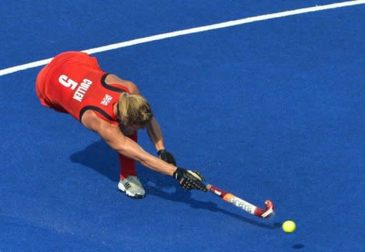 Britain's Crista Cullen shoots a goal during their women's field hockey bronze medal match against New Zealand at The Riverbank Arena in London. Britain won 3-1