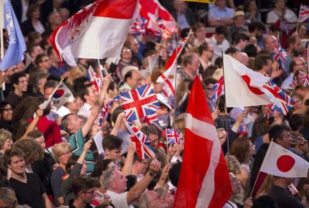 Revellers wave flags during the last night of the BBC Proms festival of classical music at the Royal Albert Hall in London, Britain September 12, 2015. REUTERS/Neil Hall