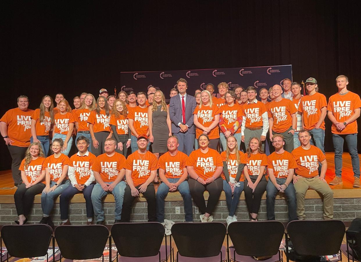 Charlie Kirk, founder of Turning Point USA, poses with members of student chapters of Turning Point USA from MSU and Southern Baptist University at the Plaster Student Union Theater on the Missouri State University campus in Springfield on October 19, 2023.