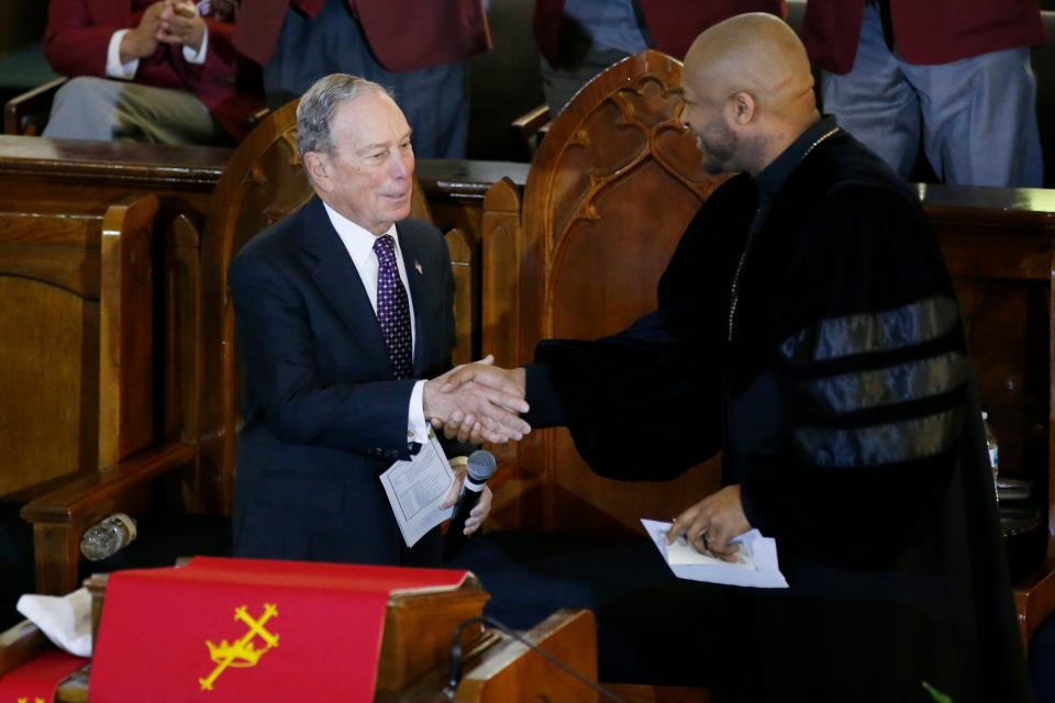 Former New York Mayor Michael Bloomberg greets the Rev. Robert Turner in Tulsa, Oklahoma, on Jan. 19, 2020.