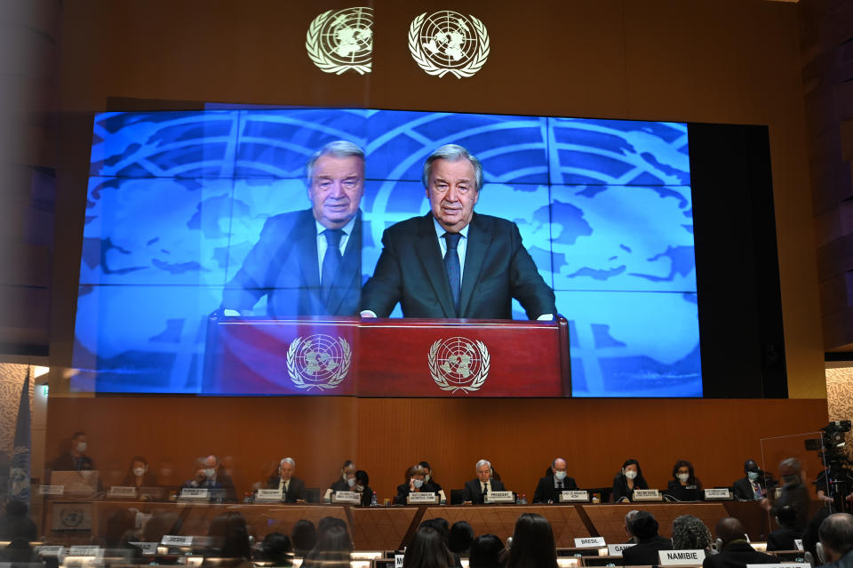 UN Secretary-General Antonio Guterres is seen on a screen delivering a remote speech during the opening of the 49th session of the UN Human Rights Council in Geneva, Switzerland, Monday, Feb. 28, 2022. The war in the Ukraine will be the main topic of the UN Human Rights Council session. (Fabrice Coffrini/Keystone via AP, Pool)