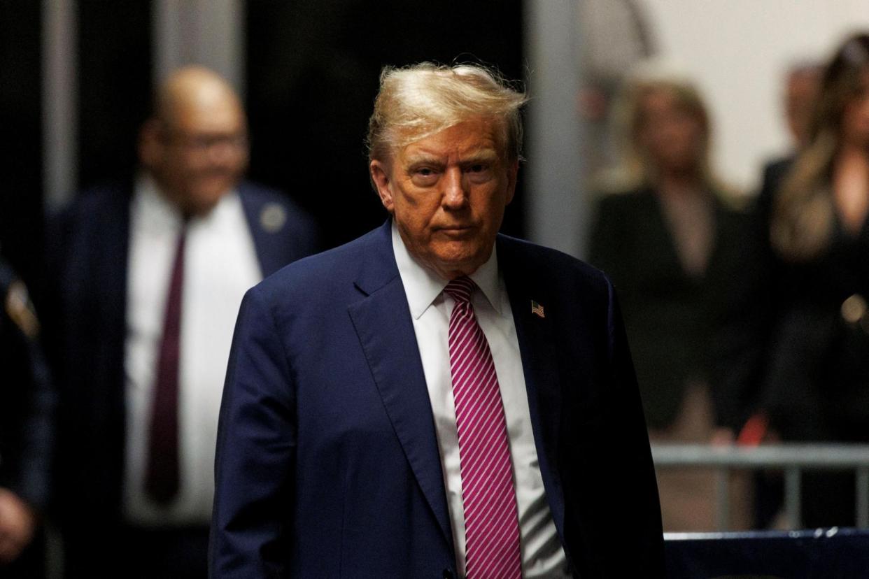 <span>Donald Trump outside court in New York on Friday.</span><span>Photograph: Sarah Yenesel/Reuters</span>