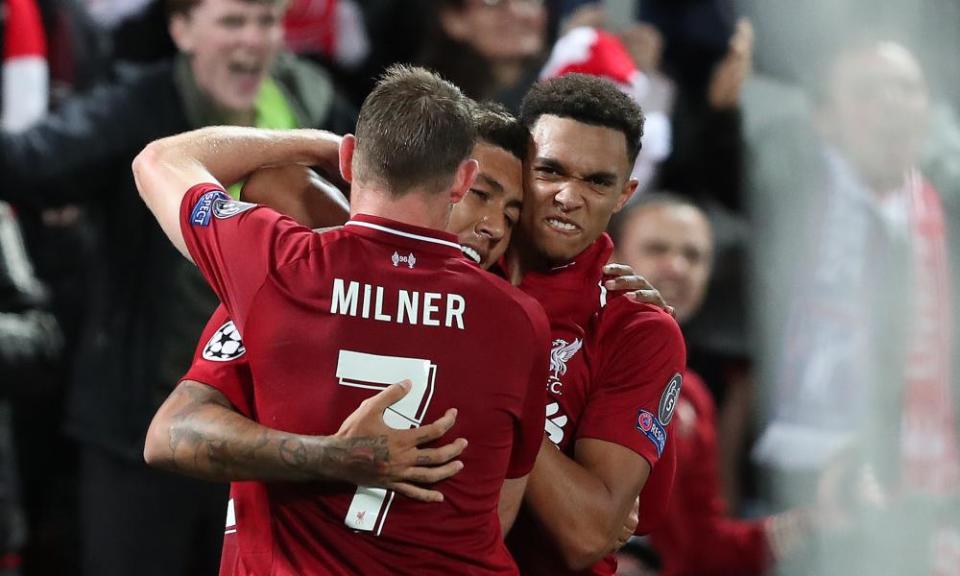 James Milner and Trent Alexander-Arnold celebrate with Roberto Firmino after his dramatic late winner.