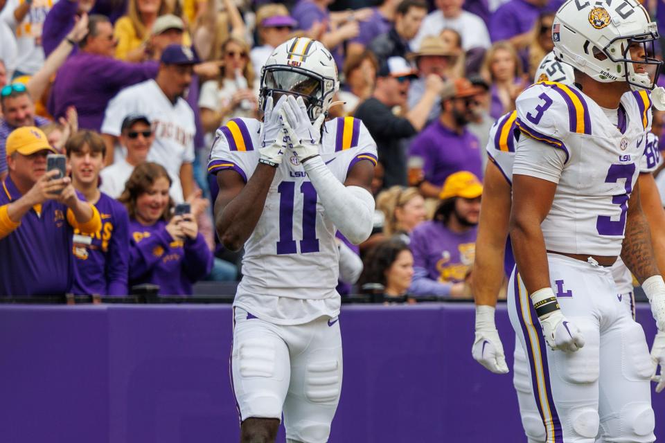 LSU receiver Brian Thomas Jr. (11) catches a touchdown against Texas A&M in November. [Stephen Lew/USA Today Sports]