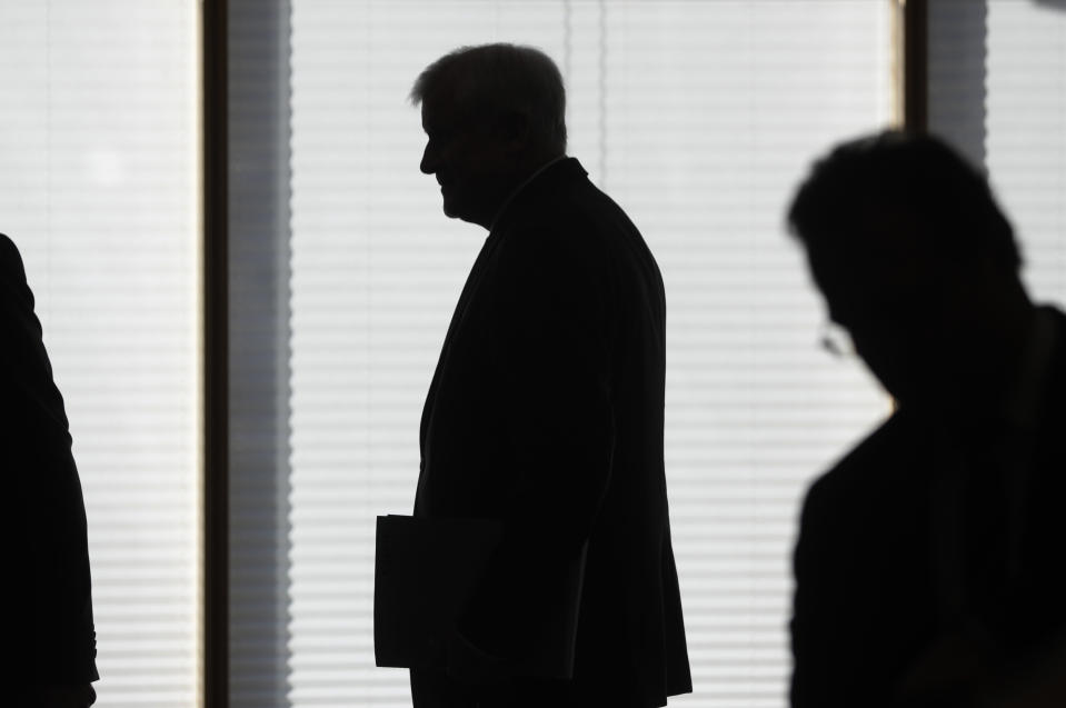 German Interior Minister and CSU chairman Horst Seehofer arrives for a party board meeting in the headquarters of the Christian Social Union, CSU, in Munich, Germany, Monday, Oct. 15, 2018, the day after their party lost the absolute majority in Bavaria's state parliament by a wide margin. (AP Photo/Matthias Schrader)