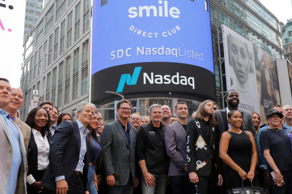 David Katzman (C), CEO of SmileDirectClub celebrates as the company debuts its IPO outside the Nasdaq MarketSite in New York, U.S. September 12, 2019. REUTERS/Lucas Jackson