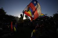 Members of the Movement for Homosexual Integration and Liberation celebrate after lawmakers approved legislation legalizing marriage and adoption by same-sex couples, in Santiago, Chile, Tuesday, Dec. 7, 2021. (AP Photo/Esteban Felix)