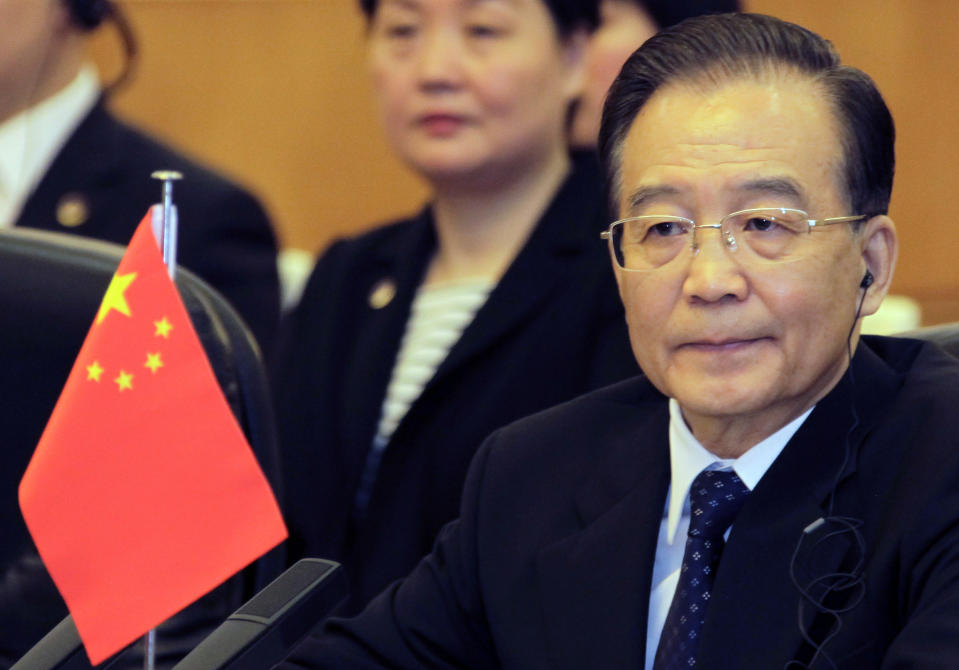 China's Premier Wen Jiabao attends a meeting of the fifth trilateral summit among China, South Korea and Japan at the Great Hall of the People in Beijing Sunday, May 13, 2012.(AP Photo/Petar Kujundzic, Pool)