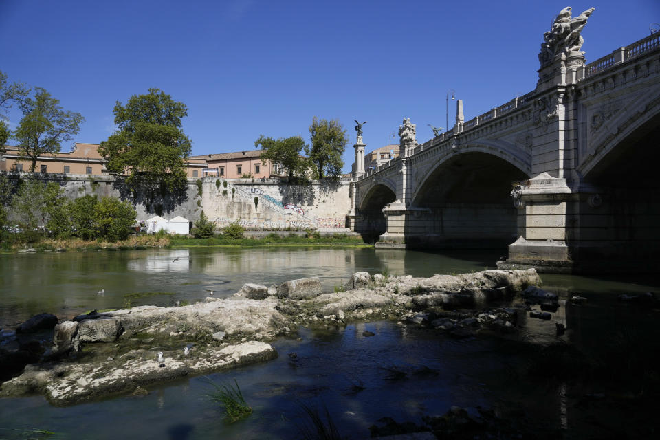 The ruins of the ancient Roman Neronian bridge, emerge from the river bed of the Tiber river, in Rome, Monday, Aug. 22, 2022. Italy’s worst drought in 70 years has exposed the piers of an ancient bridge over the Tiber River once used by Roman emperors but which fell into disrepair by the 3rd Century. (AP Photo/Gregorio Borgia)