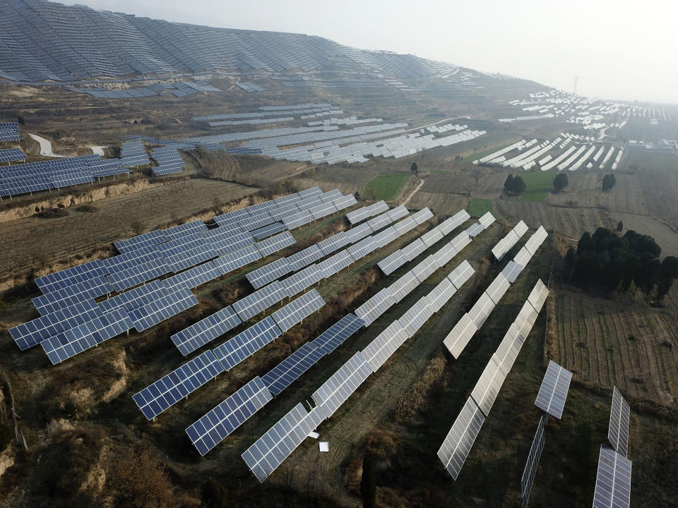 In this Nov. 28, 2019, photo, a solar panel installation is seen in Ruicheng County in central China's Shanxi Province. As world leaders gather in Madrid to discuss how to slow the warming of the planet, a spotlight is falling on China, the top emitter of greenhouse gases. China burns about half the coal used globally each year. Yet it's also the leading market for solar panels, wind turbines and electric vehicles. (AP Photo/Sam McNeil)