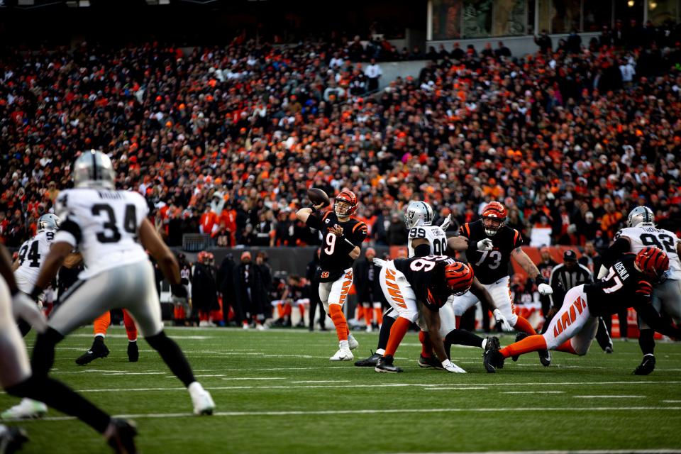 Cincinnati Bengals quarterback Joe Burrow (9) throws a pass in the first half the AFC wild card game between the Cincinnati Bengals and the Las Vegas Raiders on Saturday, Jan. 15, 2022, at Paul Brown Stadium in Cincinnati. 