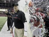 Atlanta Falcons head coach Dan Quinn is dunked during the second half of the NFL football NFC championship game against the Green Bay Packers, Sunday, Jan. 22, 2017, in Atlanta. The Falcons won 44-21 to advance to Super Bowl LI. (AP Photo/David J. Phillip)