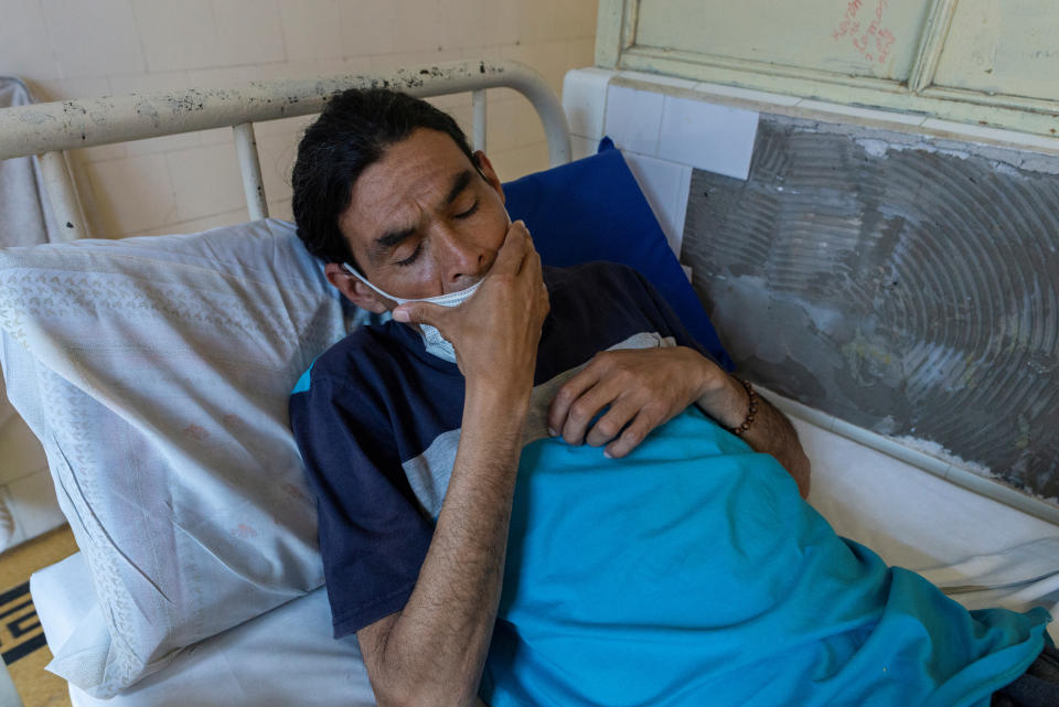 Luis Barraga, 40, who has tuberculosis, waits for his lunch to be served in his hospital room at the Muniz public hospital in Buenos Aires, Argentina, Oct. 8, 2019. Luis was living on the street when he was admitted, weighing 45kg. In the two weeks that he had been there, his weight had increased to 60kg. (Photo: Magali Druscovich/Reuters)