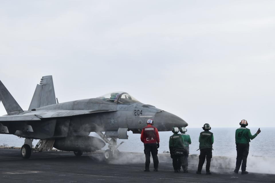 A fighter jet prepares for takeoff on the USS Dwight D. Eisenhower.