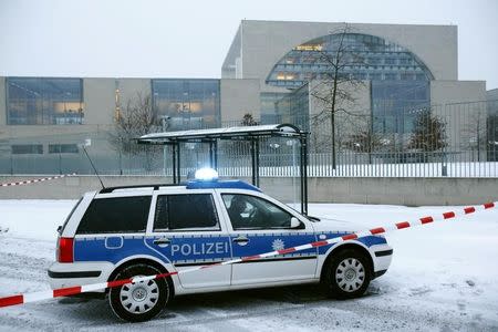A police car is parked in front of the chancellory in Berlin, Germany on January 6, 2016. REUTERS/Hannibal Hanschke