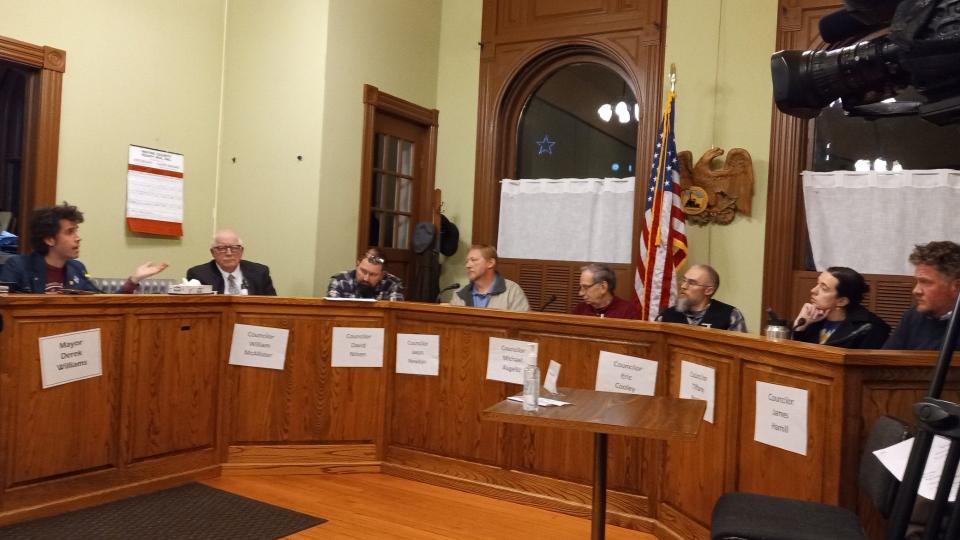 Honesdale Borough Council, Nov. 27, 2023, at City Hall. From left: Mayor Derek Williams and councilors William McAllister, David Nilsen, Jared Newbon, President Michael Augello, Eric Cooley, Tiffany Rogers and James Hamill. The Star on Irving Cliff is visible in the window at left.