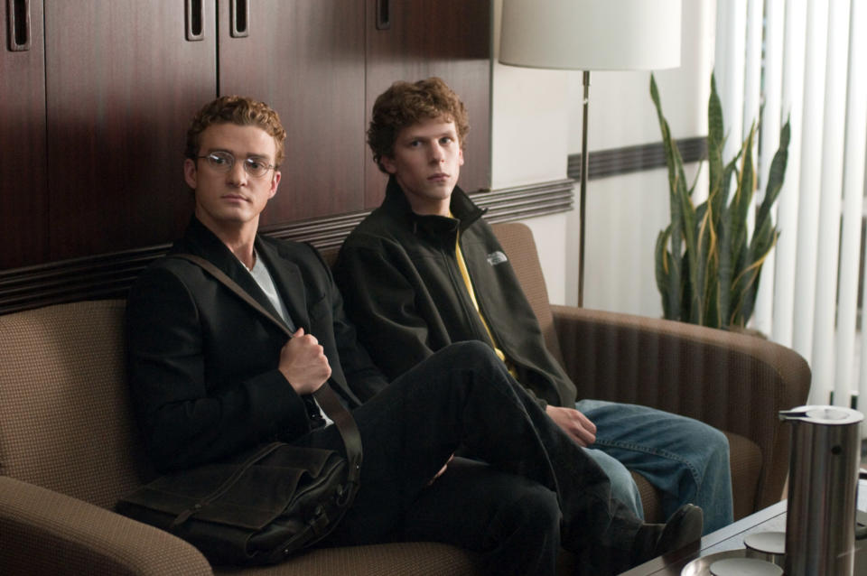 Justin Timberlake and Jesse Eisenberg sit on a couch