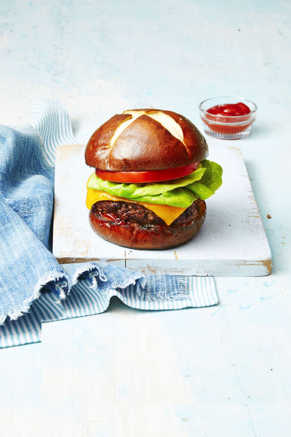 <p>Give your burgers a kick with the addition of horseradish, spicy mustard and Worcestershire. Then, pair it with a sweet pretzel bun to balance the whole thing out.</p><p><em><a href="https://www.goodhousekeeping.com/food-recipes/a38754/deviled-burger-recipe/" rel="nofollow noopener" target="_blank" data-ylk="slk:Get the recipe for Deviled Burger »;elm:context_link;itc:0;sec:content-canvas" class="link ">Get the recipe for Deviled Burger »</a></em> </p>