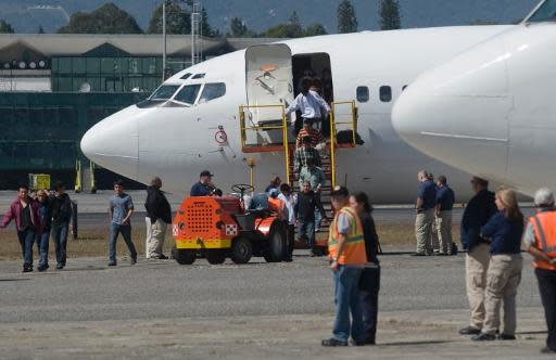 Migrantes guatemaltecos deportados desde Estados Unidos llegan al aeropuerto de la Ciudad de Guatemala el 28 de diciembre de 2012 (AFP/Archivos | Johan Ordonez)