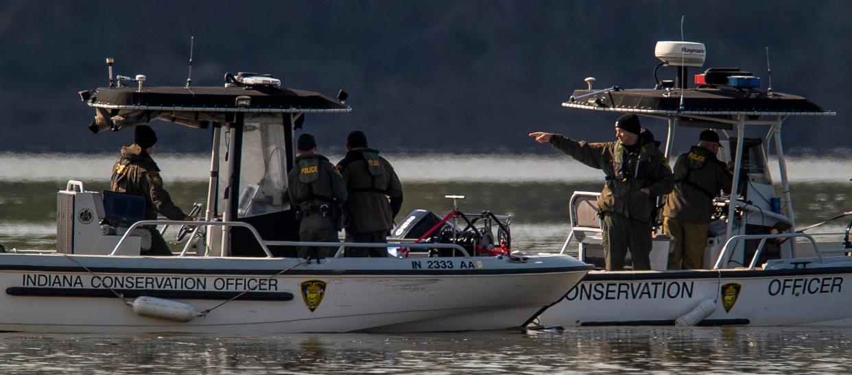 Indiana Conservation Officers search Lake Monroe for two Indiana University students who went missing while swimming in April. Their bodies were recovered after a three-day search. Two more people drowned in the lake over the weekend.