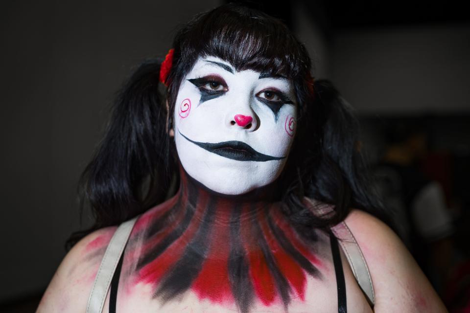 Kayla Rojas paints her face as Billy the Puppet from the Saw franchise for the El Paso Horrorfest on Saturday, Oct. 7, 2023, at the convention center.