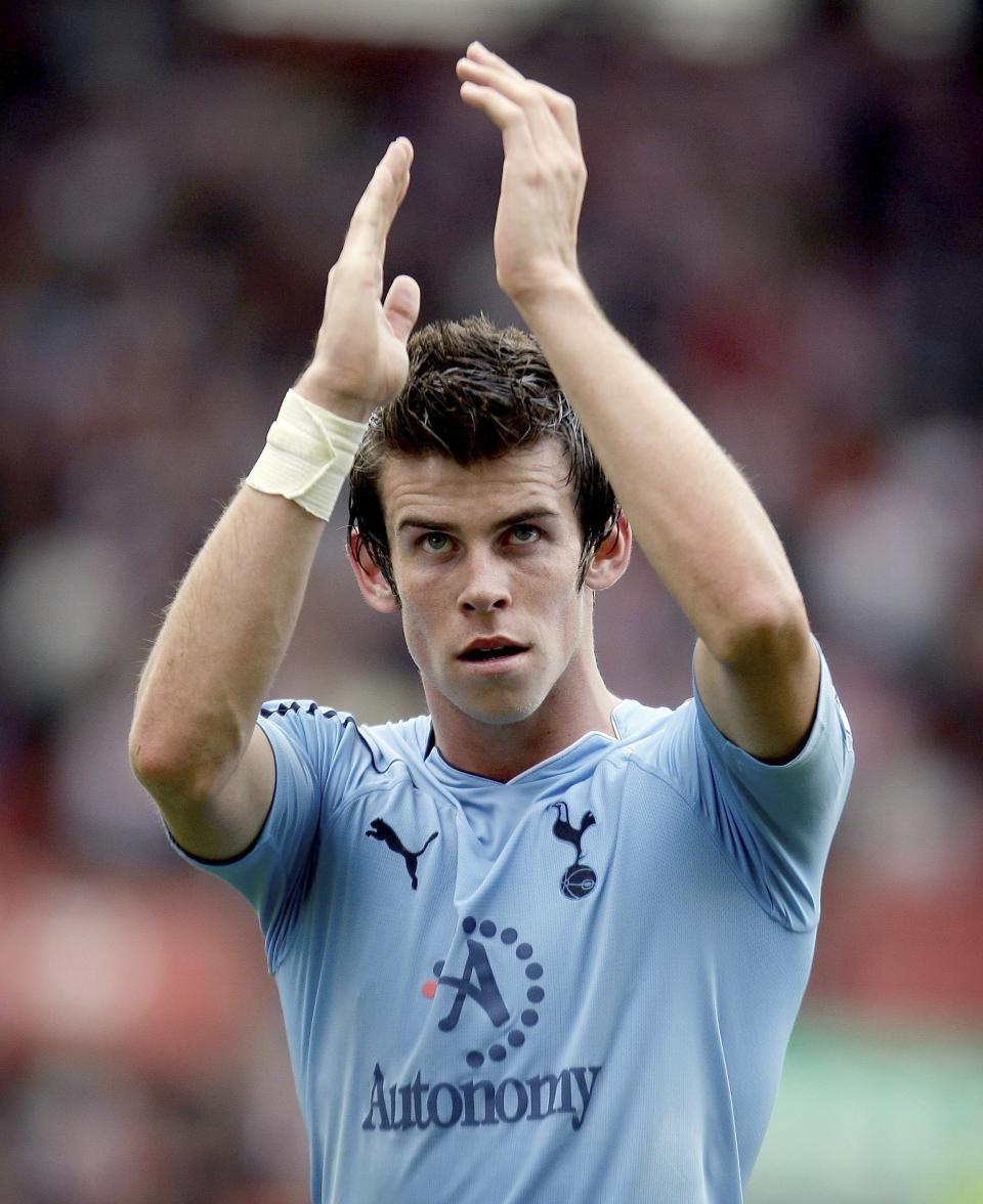FILE - Tottenham Hotspurs Gareth Bale gestures during their English Premier League soccer match against Stoke City at the Britannia stadium, Stoke, England, Saturday Aug. 21, 2010. Bale has announced on Monday, Jan. 9, 2023, his retirement from soccer at age 33. He scored 53 Premier Leagues goals and 81 in La Liga, finishing last season by helping Los Angeles win the Major League Soccer title. Bale won five Champions League titles, three Spanish league titles, one Copa del Rey and one League Cup (AP Photo/Simon Dawson, File)