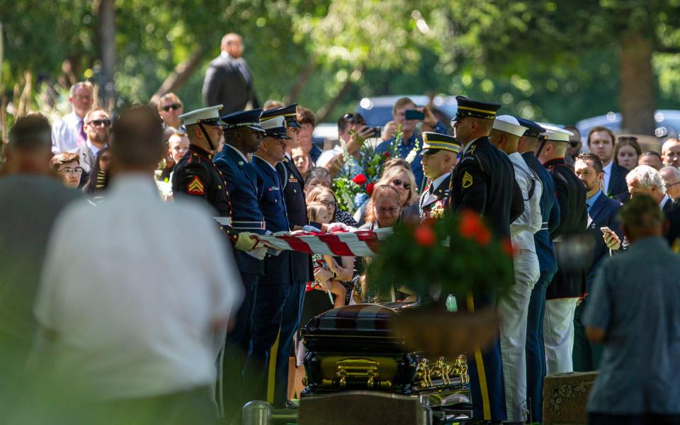 The Joint Forces Body Bearer team performs the flag-folding ceremony during the burial of the late congresswoman Jackie Walorski on Thursday, Aug. 11, 2022, in South Bend.