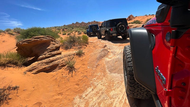A photo of two Jeep Wranglers on an off-road trail. 