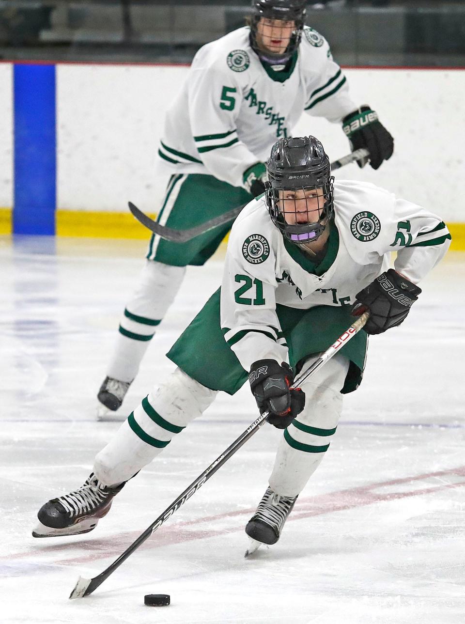 Rams #21 Teddy Devoe makes a move across the red line with support from Ryland McGlame.Marshfield hosted Xaverian in boys hockey at The Bog in Kingston on Thursday February 23, 2023 