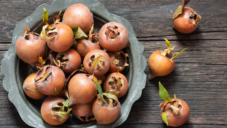 bowl of ripe medlars