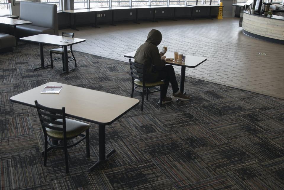 <span class="caption">Stigma and lack of awareness prevent students from getting food assistance.</span> <span class="attribution"><a class="link " href="https://www.gettyimages.com/detail/news-photo/student-eats-lunch-at-brooks-dining-hall-on-the-university-news-photo/1231259787?adppopup=true" rel="nofollow noopener" target="_blank" data-ylk="slk:Derek Davis/Portland Press Herald via Getty Images;elm:context_link;itc:0;sec:content-canvas">Derek Davis/Portland Press Herald via Getty Images</a></span>