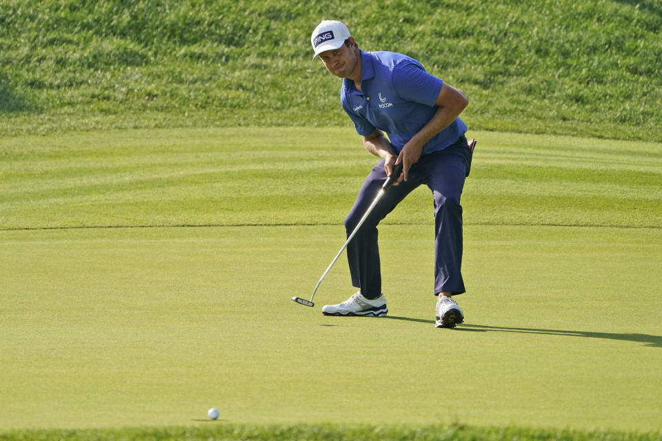 Harris English watches a birdie putt drop into the hole on the 18th green during the final round of the Travelers Championship golf tournament at TPC River Highlands, Sunday, June 27, 2021, in Cromwell, Conn. (AP Photo/John Minchillo)