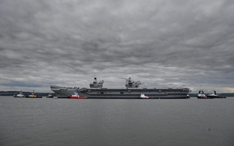 The new Royal Navy aircraft carrier HMS Queen Elizabeth departs Rosyth dockyard to be tested in the North Sea on June 26, 2017 in Rosyth, Scotland - Credit:  Jeff J Mitchell/Getty