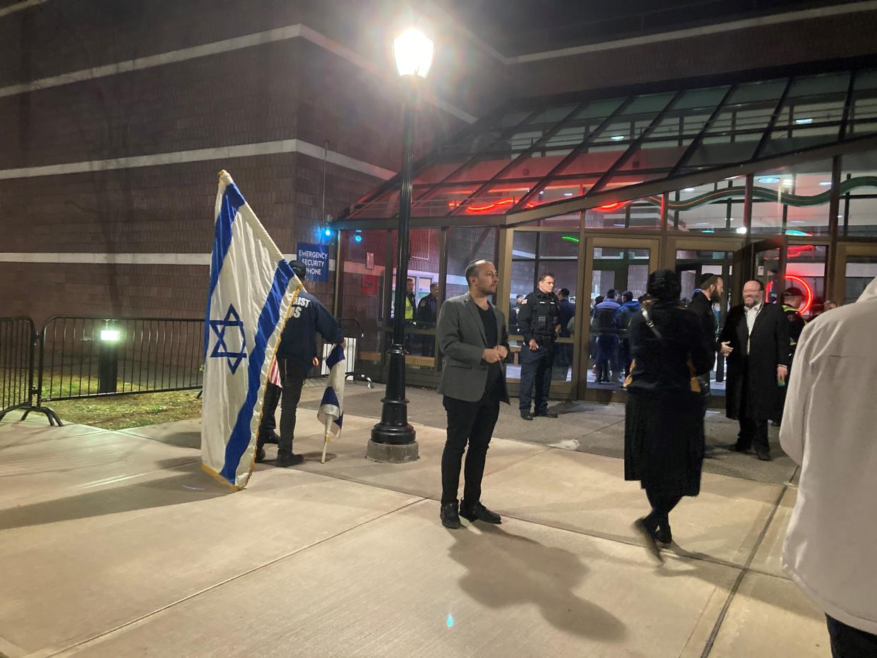 A supporter of Israel stood with an Israeli flag by the entrance to Building 7 at Rockland Communty College for Rep. Mike Lawler's Town Hall on Nov. 19, 2023.